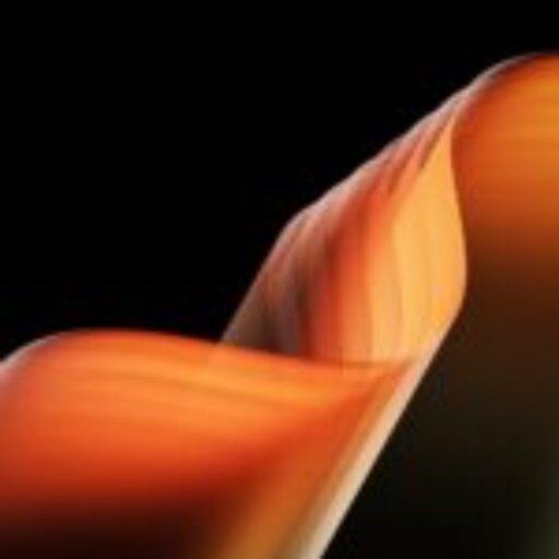 a black background with an orange and yellow wave